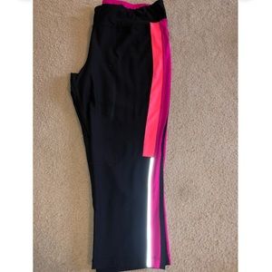 Black crop leggings with neon pink & orange side